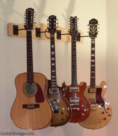 It takes up little space in my even smaller room and looks awesome against the wall with all of my main guitars. 4 guitar wall mount | Guitar wall, Guitar, Guitar hanger