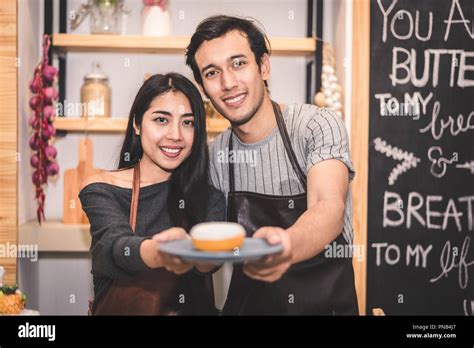 Young Couples Making Bakery Donuts And Bread At Bakery Shop As Business Ownership Entrepreneur