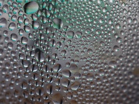 Water Drops On The Glass In A Cool Blue Tones In The Rainy Season For