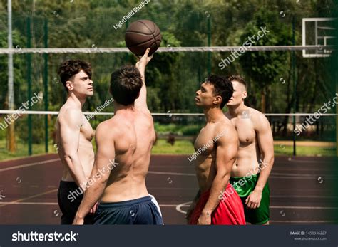 Four Sexy Shirtless Basketball Players Training Stock Photo