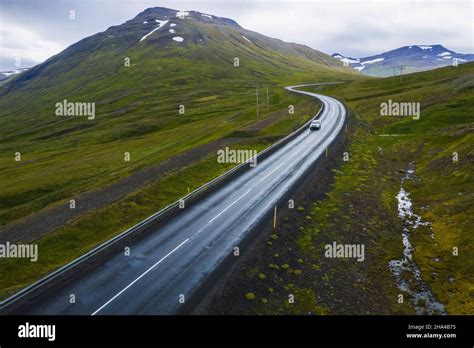 Lonely Car Drive On Beautiful Remote Road Hi Res Stock Photography And