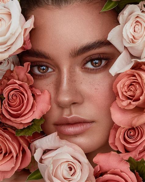 A Woman With Flowers Around Her Face And The Image Is Made Up Of Pink Roses