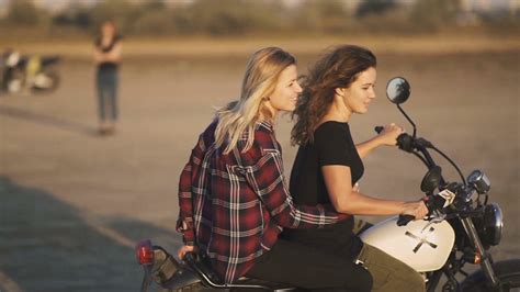 Beautiful Young Woman Motorcyclist With His Girlfriend Riding A