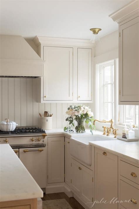 The wood counters and floor warm up the pale hues, as do a few brightly colored. Cream Kitchen Cabinet Custom Paint Color | Julie Blanner