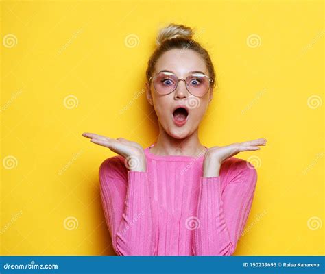 Shot Of Stupefied Shocked Blonde Woman Keeps Mouth Widely Opened Looks