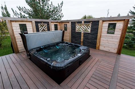 Built In Hot Tub Designs With Low Maintenance Deck And Faux Rock