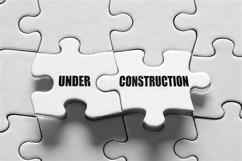Under Construction Message Surrounded By Puzzle Pieces Website