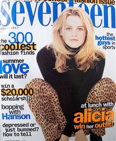 a magazine cover with a woman sitting on the floor wearing leopard print leggings