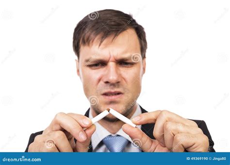 Young Businessman Breaking A Cigarette Concept For Give Up Smoking