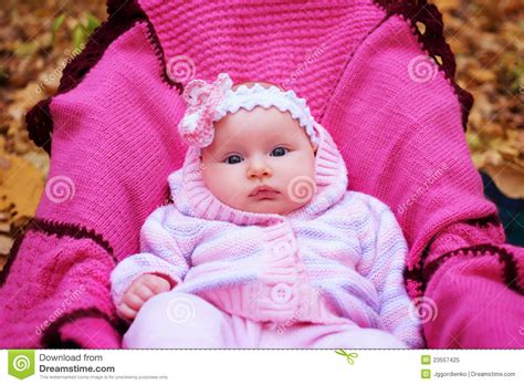 Beautiful Girl In A Pink Baby Clothes Royalty Free Stock