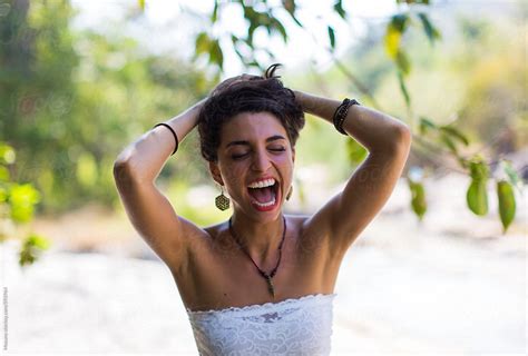 Young Woman Laughing Out Loud By Stocksy Contributor Mosuno Stocksy