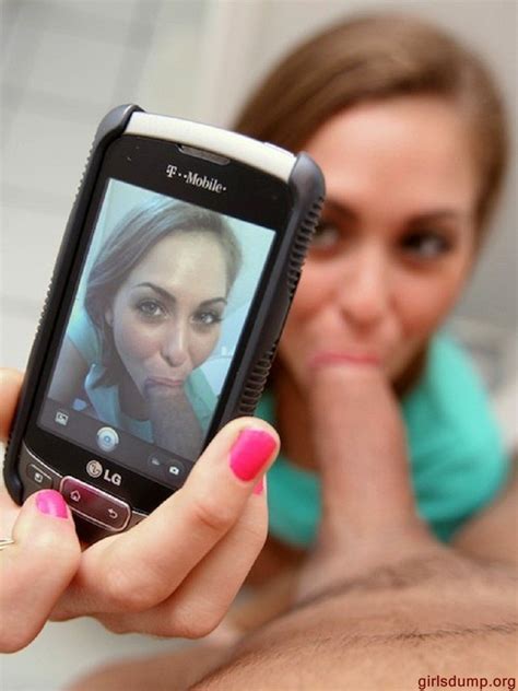 Slut Taking Selfie While Blowing Cock