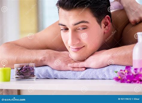 The Handsome Man In Spa Massage Concept Stock Photo Image Of Candle Care