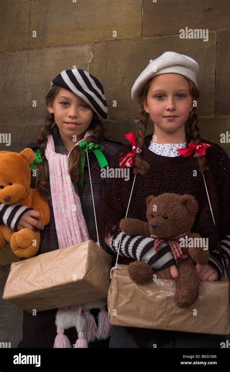Two Young Girls Dressed As World War 2 Evacuees At The Pickering War