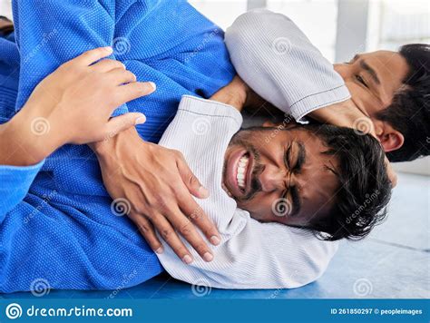 Karate Martial Arts And Men In Choke Hold On Gym Mat For Wrestling Game Match And Practice