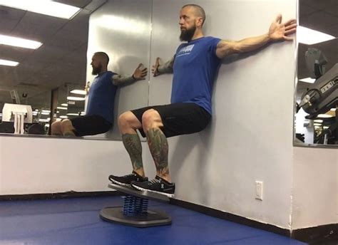 Wall Squats With Strongboard Balance Board Exercise Guide