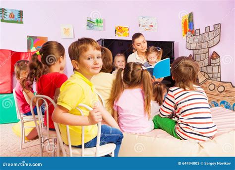 Kids Listen To Teacher Storytelling Reading Book Stock Image Image Of