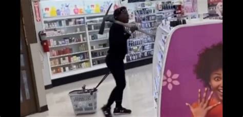 Watch California Has Gone Nuts —woman Robs Rite Aid With Pickaxe While Customers Watch In