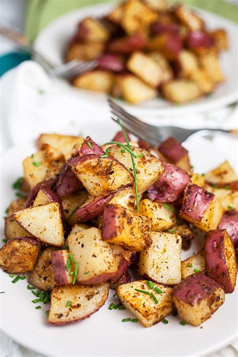 Peeled potatoes drizzled with olive oil, sprinkled with favorite seasoning and roasted to perfection. Herb Roasted Potatoes | The Rustic Foodie