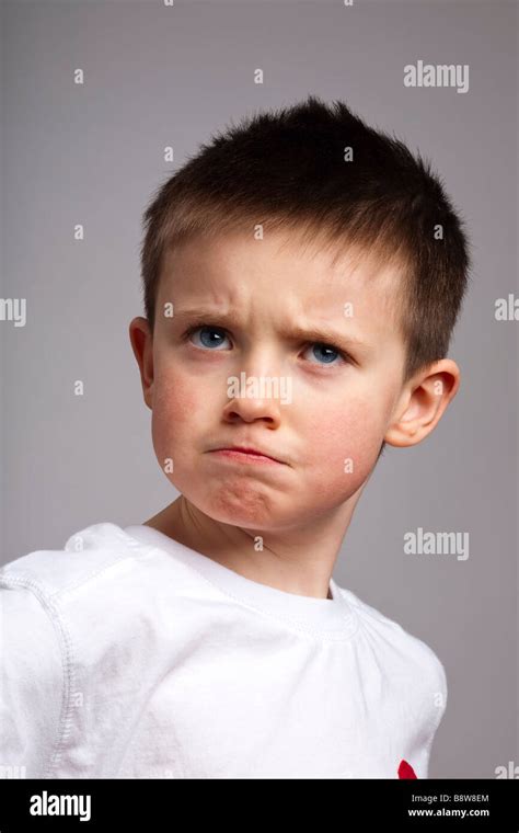 Portrait Of Little Boy With Angry Expression Stock Photo Alamy