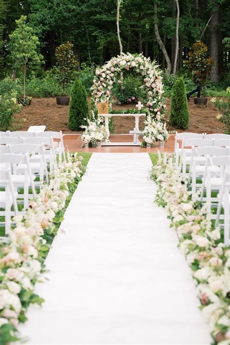 Vibrant pinks, corals and oranges set the tone for this lush spring garden wedding style shoot planned by avp weddings & events. The Barn of Chapel Hill Spring Wedding by C and D Events