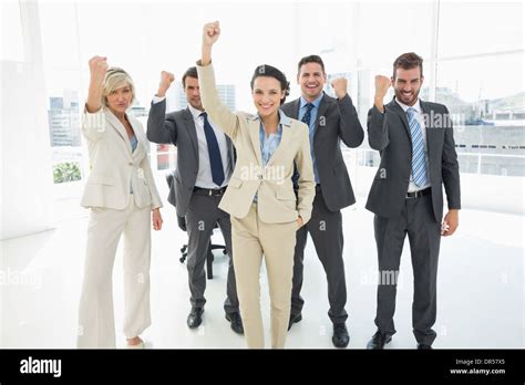 Successful Business Team Clenching Fists In Office Stock Photo Alamy