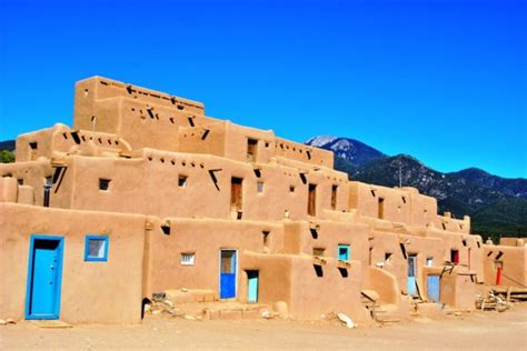 Taos Pueblo The Native American Settlement Of Multi Story Adobe Dwellings