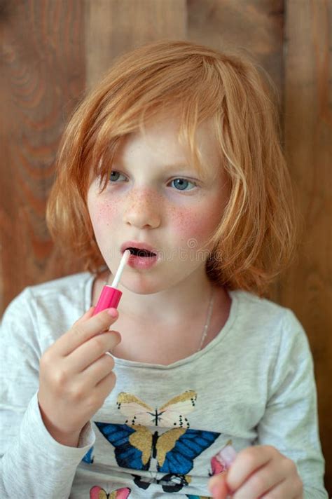 The Girl Paints Lips With Brilliance Stock Image Image Of Child