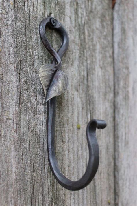 We would like to show you a description here but the site won't allow us. Decorative metal hook , Gold Leaf Hook blacksmith made, entryway hook, coat hanger, towel hook ...