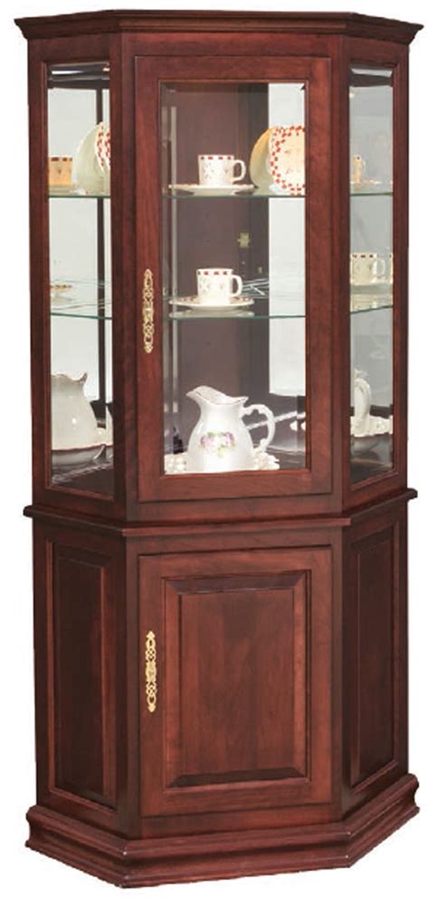 Corner curio cabinet is the perfect option to display your collectives. Amish Corner Curio Cabinet with Encosed Base
