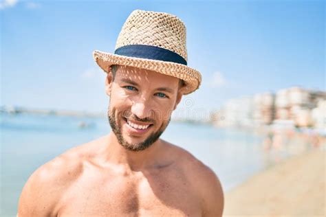 Handsome Fitness Caucasian Man At The Beach On A Sunny Day Wearing