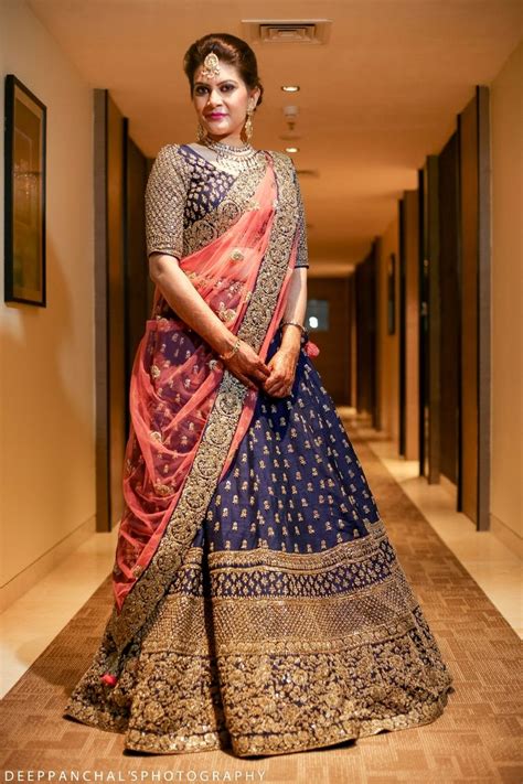Blue and pink is pretty common, but these two offbeat shades look wonderful together! Photo of Navy Blue Sangeet Lehenga with Light Pink Dupatta ...