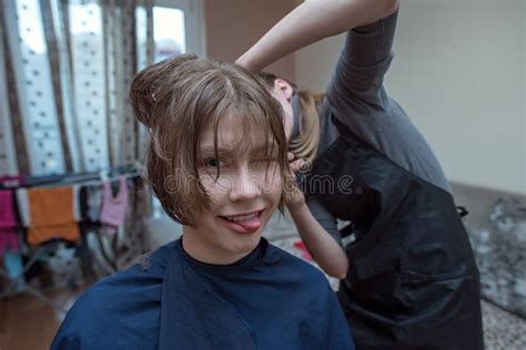 Women S Haircut At Home Hairdresser Cuts A Girl At Home Stock Image