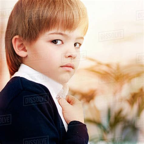 Close Up Of Caucasian Boy Wearing Schoolboy Uniform Stock Photo