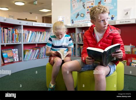 Boy And Girl In Library Hi Res Stock Photography And Images Alamy