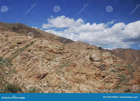 In The Distance There Is A Tall And Rugged Mountain Stock Photo