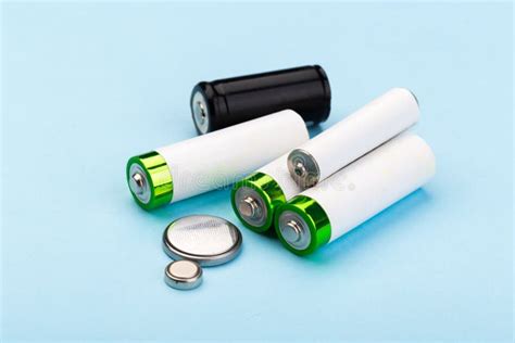 Many New And Used Batteries Of Different Shapes Aa Round Batteries On