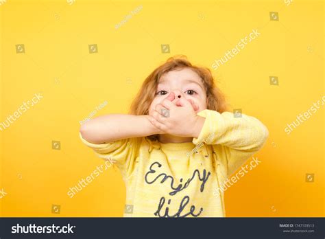 Cute Little Girl Covering Her Mouth Stock Photo 1747103513 Shutterstock