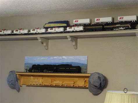 Hanging artwork from a ceiling is easy with our unique hanging track system. Double track around the ceiling layout | O Gauge ...