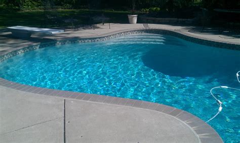 •superior bonding •high strength and rapid curing •extremely etch resistant •ease of application •aggregate exposure easily controlled •pumpable diamond brite, color midnight blue. Mosaic Tile Line with Brick Coping and Super Blue Diamond ...