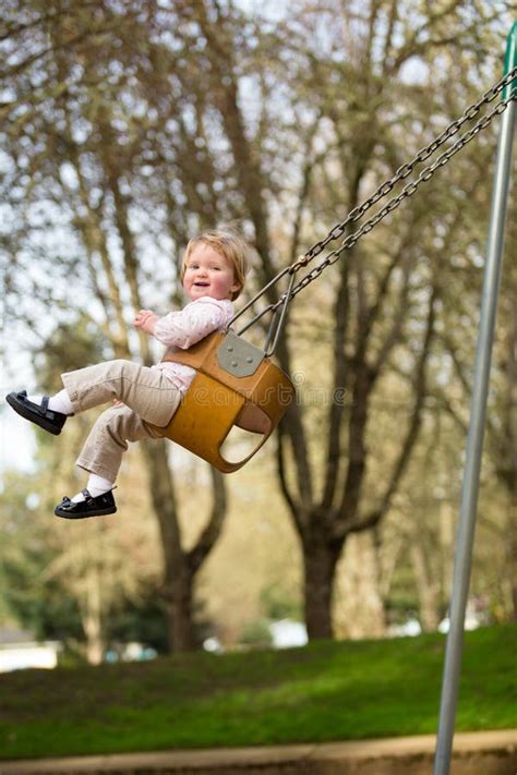One Year Old On Swings Stock Photo Image Of Yearling 50739626