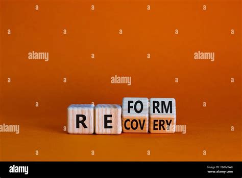 Recovery And Reform Symbol Turned Wooden Cubes And Changed The Word