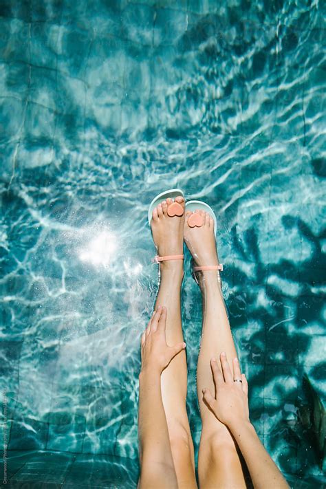Female Legs Above Pool Water By Stocksy Contributor Dreamwood Photography Stocksy