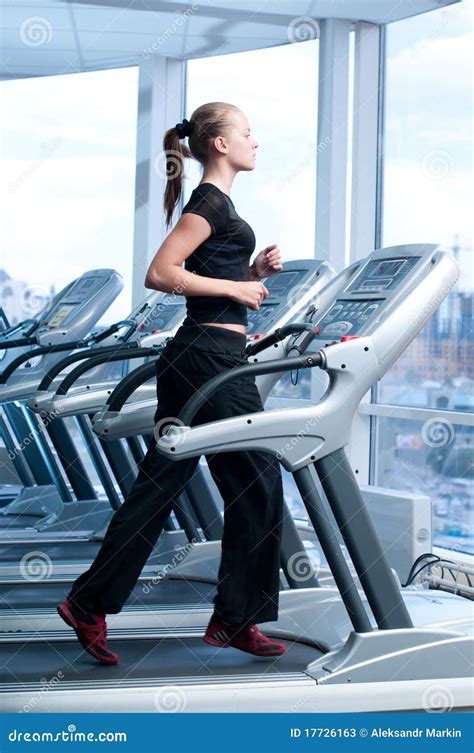 Young Woman At The Gym Run On A Machine Stock Image Image Of