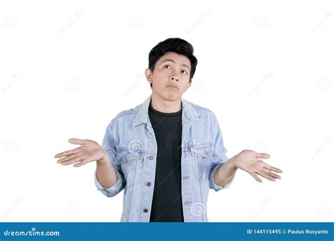 Handsome Man Stands With Poses Shrug On Studio Stock Image Image Of