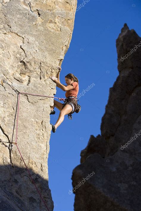 Female Climber Clinging To A Cliff Stock Photo By ©gregepperson 6409956