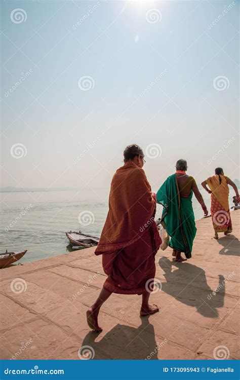 ghats in varanasi india boats at shore of the ganges river at one of the many ghats in
