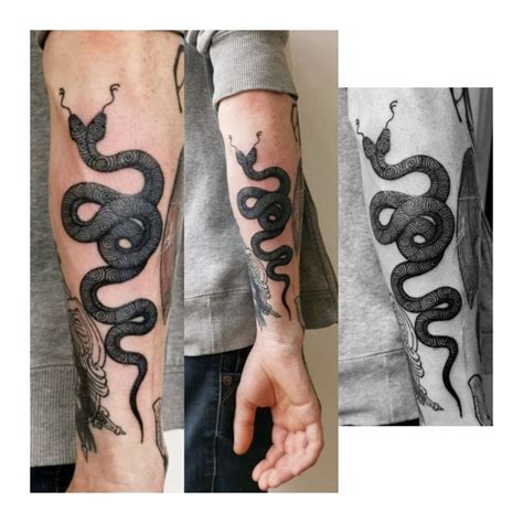 What does a two headed snake tattoo mean? two headed snake tattoo with spirales by @ananas.tattoo ...