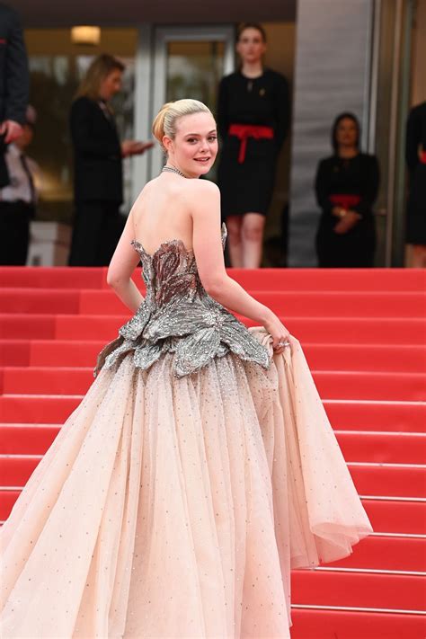 elle fanning wears blue dress and princess gown at cannes film festival 2023