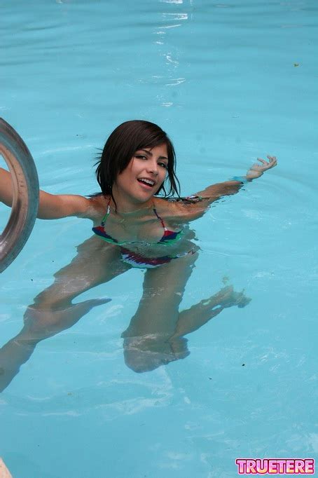 Teen Mexican Honey Poses In The Pool In A Tiny Revealing
